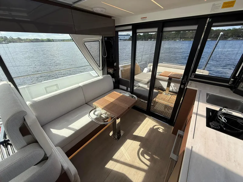 Slide: The Image of Interior of 2025 Wellcraft 44 Explorer yacht with seating and lake view. - 33