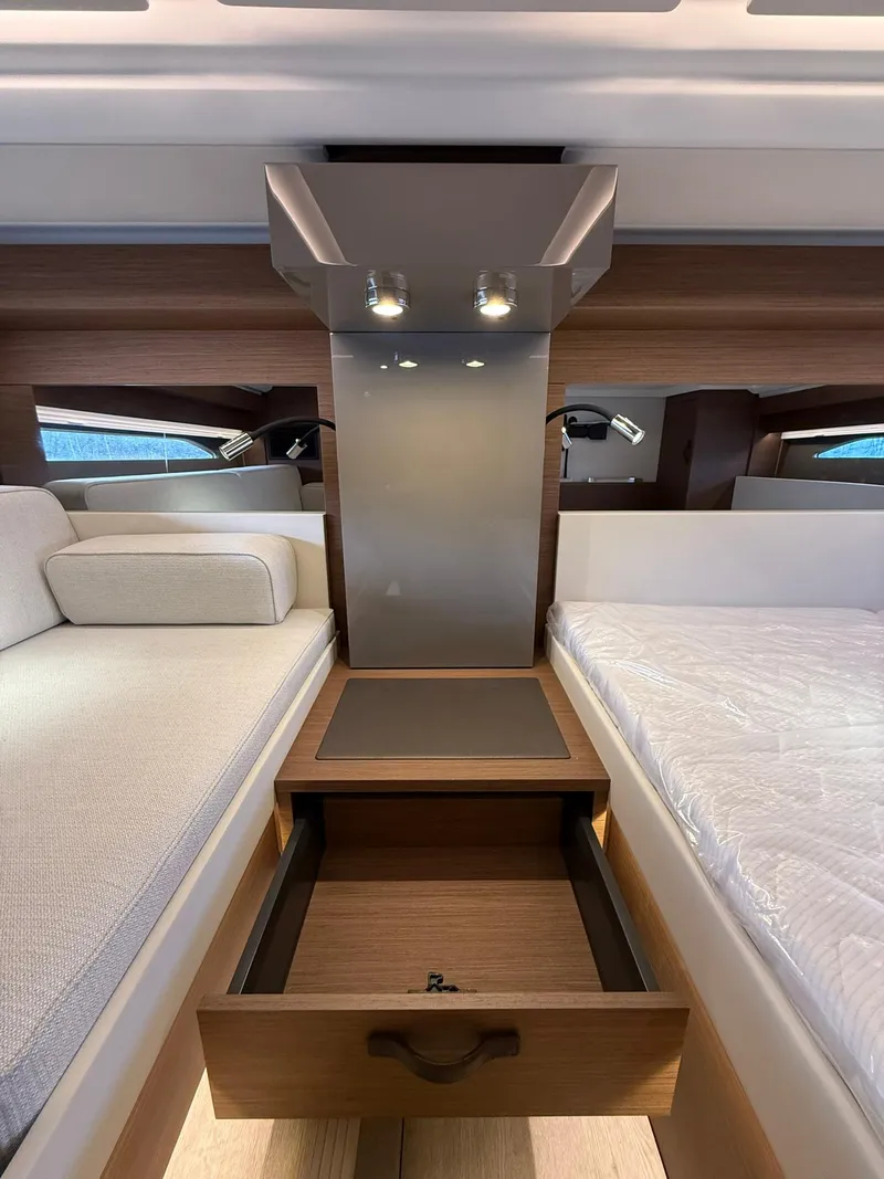 Slide: The Image of Interior of 2025 Wellcraft 44 Explorer yacht with modern wood finish and storage drawer. - 43