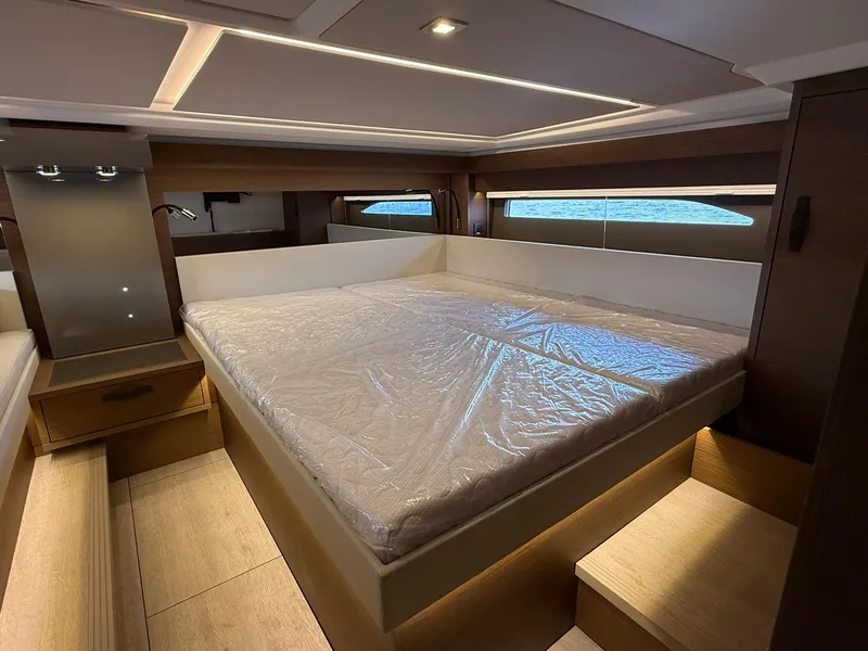 Slide: The Image of Luxurious bedroom interior of 2025 Wellcraft 44 Explorer yacht with modern design and large bed. - 44