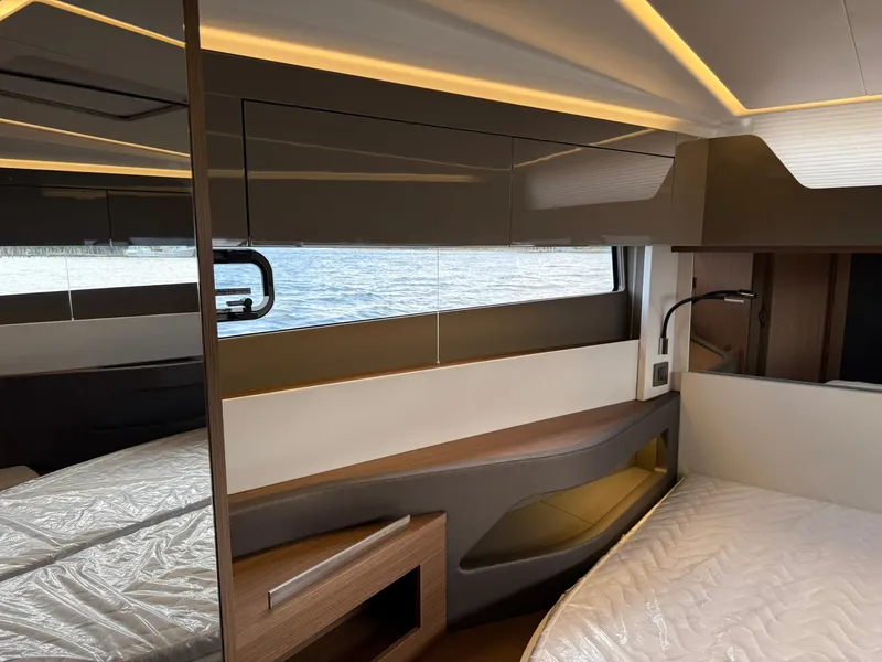 Slide: The Image of Interior of 2025 Wellcraft 44 Explorer yacht, featuring modern design and ambient lighting. - 54
