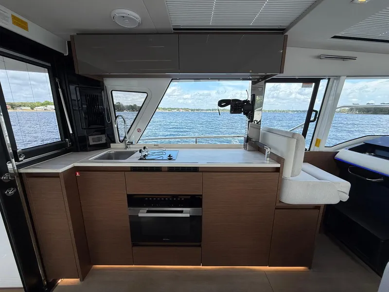 Slide: The Image of Modern kitchen interior of 2025 Wellcraft 44 Explorer yacht with scenic water view. - 9