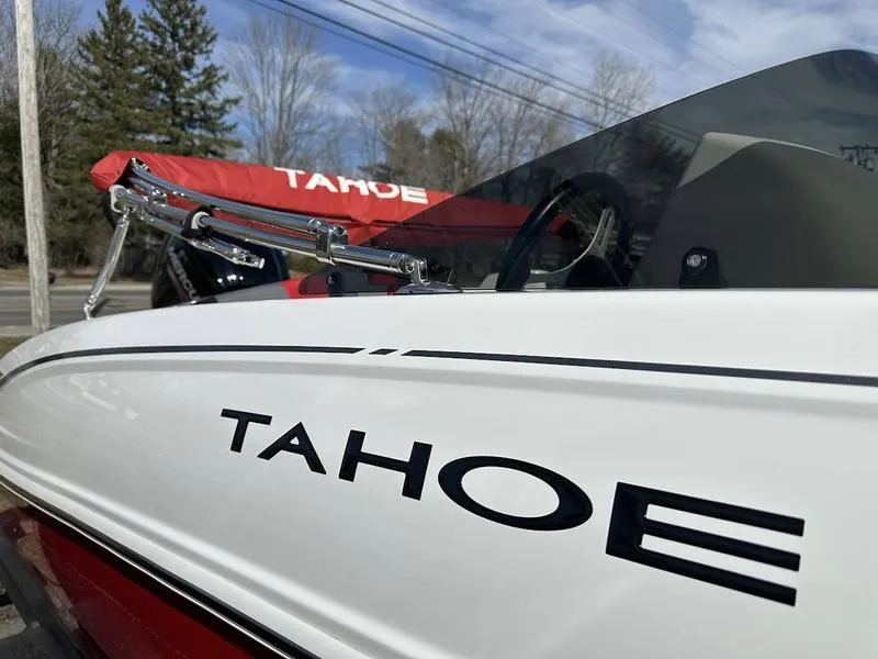 Slide: The Image of 2025 Tahoe T18 boat with sleek design and visible branding, outdoors. - 13