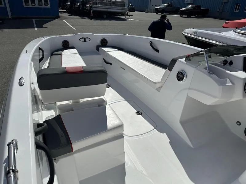 Slide: The Image of 2025 Tahoe T18 boat interior with white seating and modern design. - 6