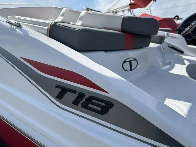 Slide: The Image of 2025 Tahoe T18 boat with sleek design and comfortable seating, featuring modern graphics. - 8