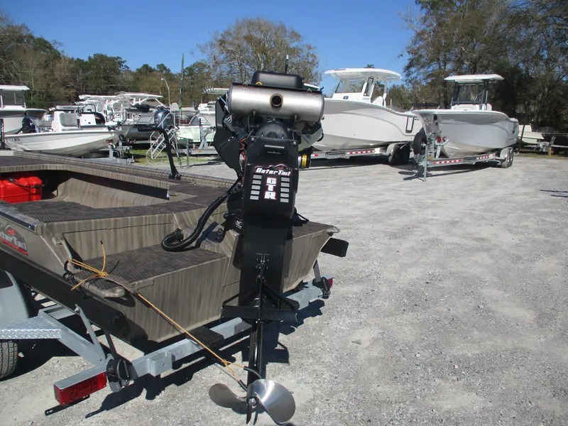 Slide: The Image of 2025 Gator Tail 1854 Extreme boat with motor in a marina setting. - 3