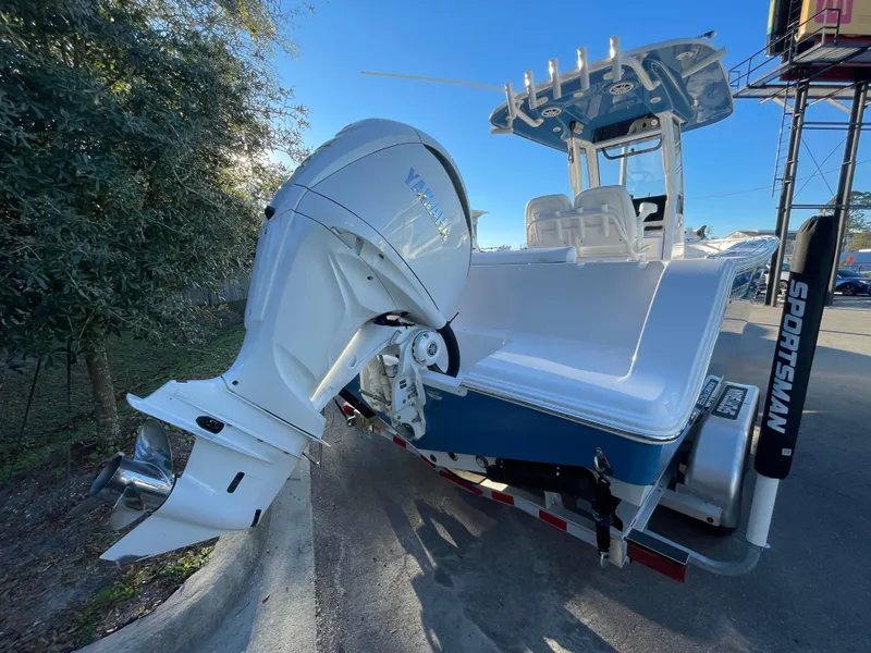 Slide: The Image of 2024 Sportsman Open 232 Center Console boat with Yamaha outboard motor. - 2