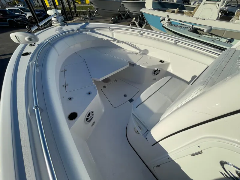 Slide: The Image of 2024 Sportsman Open 232 Center Console boat interior with seating and storage. - 3