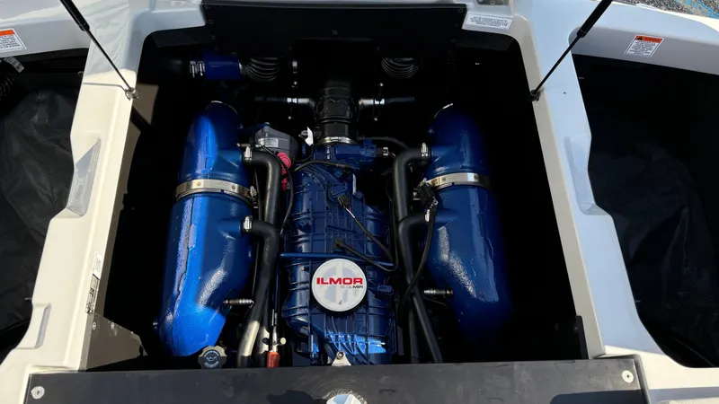 Slide: The Image of 2025 MasterCraft NXT24 engine with blue Ilmor components. - 22