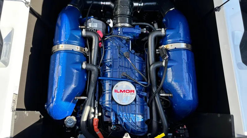 Slide: The Image of 2025 MasterCraft NXT24 Ilmor engine with blue components and detailed wiring. - 23