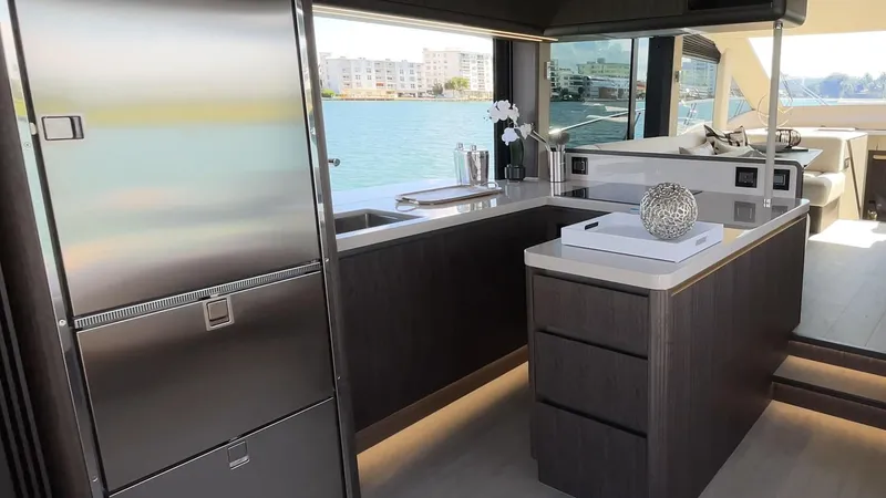 Slide: The Image of Luxurious kitchen interior of 2025 Galeon 560 Fly yacht with modern appliances and waterfront view. - 10