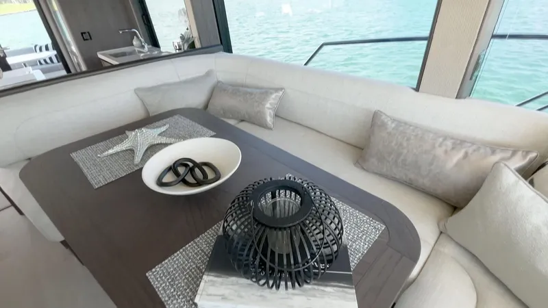 Slide: The Image of Luxurious interior of 2025 Galeon 560 Fly yacht with elegant dining area. - 11