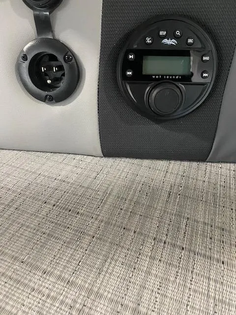 Slide: The Image of 2025 South Bay 500 boat audio system and outlet on textured surface. - 10