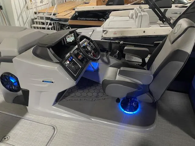 Slide: The Image of 2025 South Bay 500 boat interior with illuminated controls and modern seating. - 3