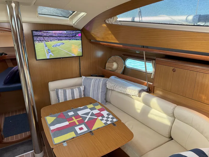 Slide: The Image of Interior of 2006 Jeanneau Sun Odyssey 42 DS yacht with cozy seating and TV. - 19