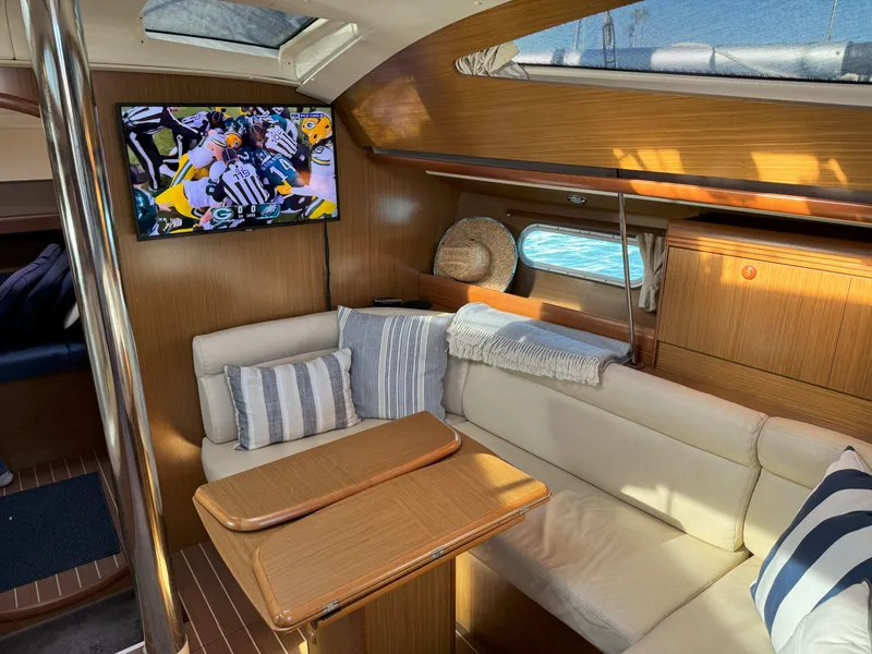 Slide: The Image of Interior of 2006 Jeanneau Sun Odyssey 42 DS yacht with cozy seating and TV. - 20