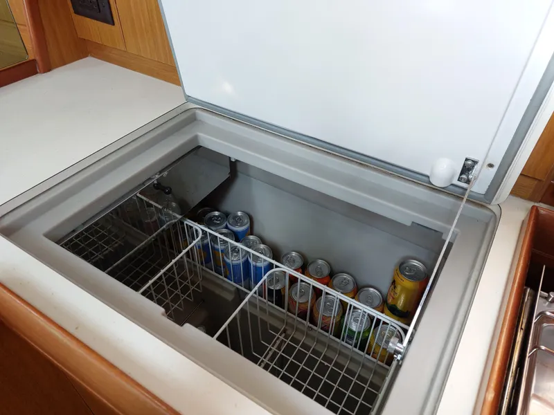 Slide: The Image of Built-in fridge with drinks on Jeanneau Sun Odyssey 42 DS, 2006 model yacht. - 25