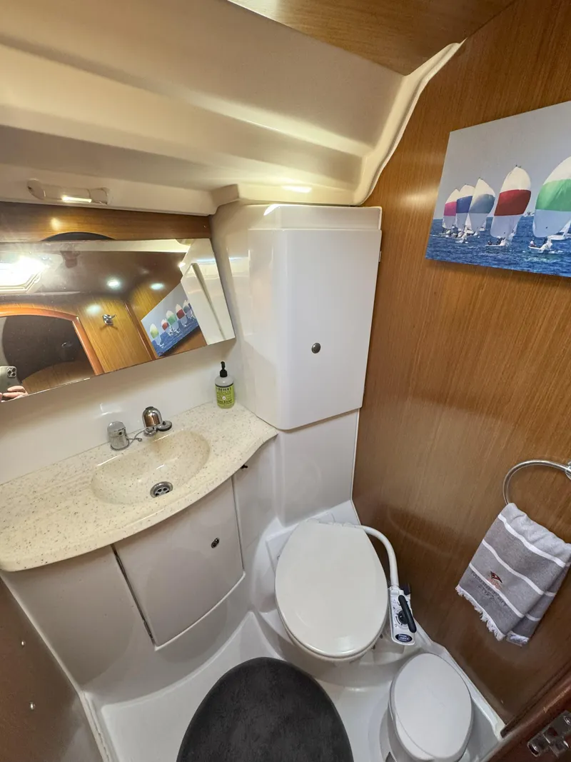 Slide: The Image of 2006 Jeanneau Sun Odyssey 42 DS bathroom with sink, toilet, and nautical decor. - 31