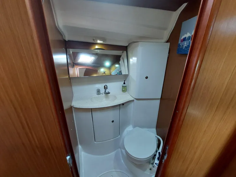Slide: The Image of Bathroom interior of 2006 Jeanneau Sun Odyssey 42 DS yacht, featuring sink and toilet. - 36