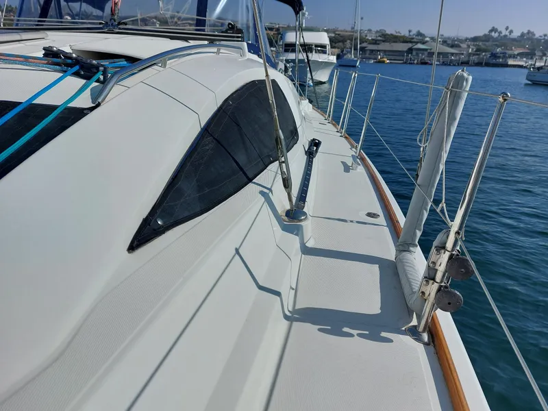 Slide: The Image of Jeanneau Sun Odyssey 42 DS sailboat deck, 2006 model, docked in a marina. - 40