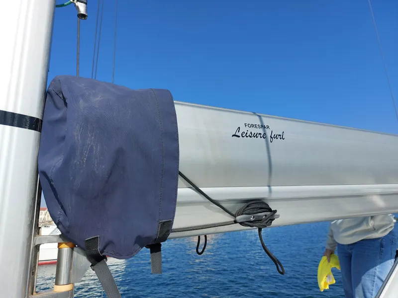 Slide: The Image of Boom of 2006 Jeanneau Sun Odyssey 42 DS sailboat against clear blue sky. - 45