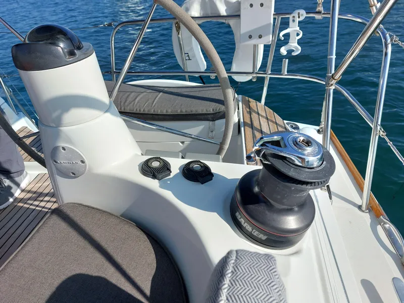 Slide: The Image of Jeanneau Sun Odyssey 42 DS 2006 yacht deck with winch and steering wheel. - 49