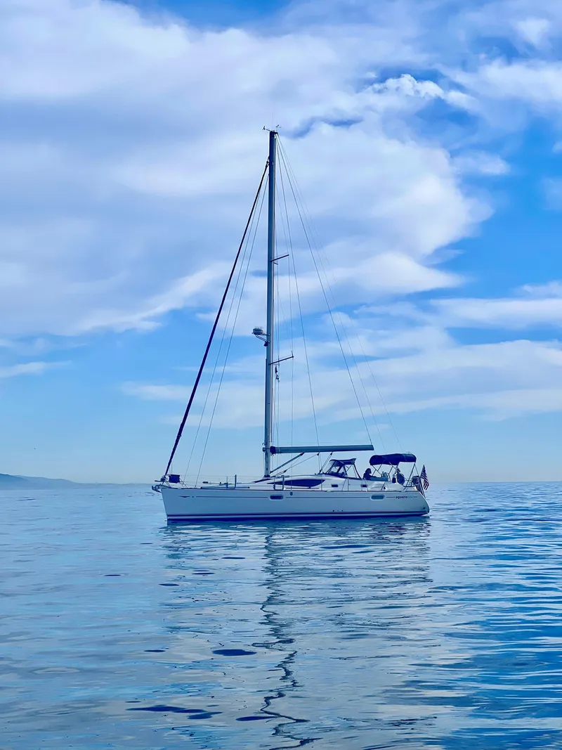 Slide: The Image of Sailboat Jeanneau Sun Odyssey 42 DS 2006 on calm sea under blue sky. - 8
