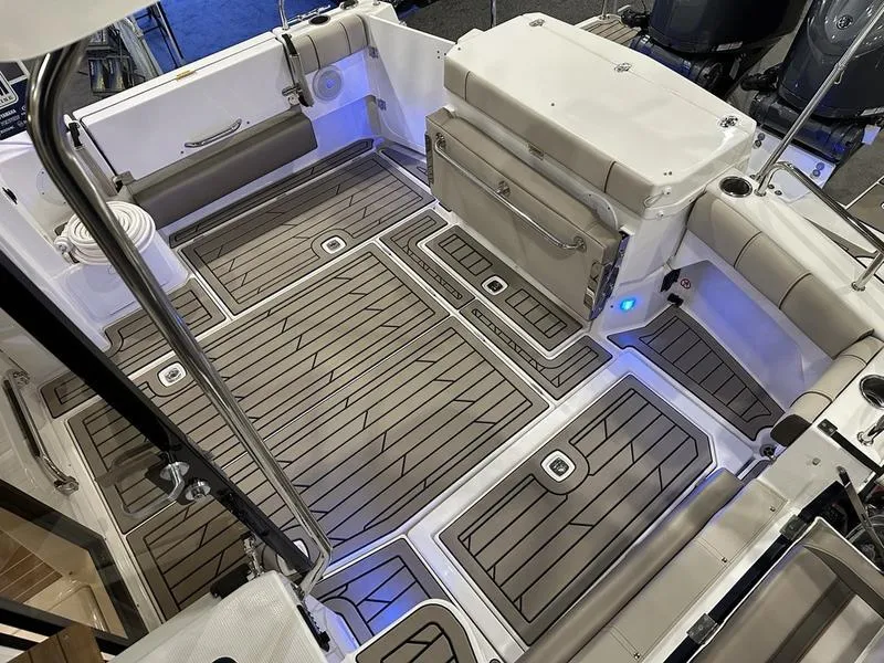 Slide: The Image of 2025 Cutwater C-32 CB LE boat interior with sleek, modern deck design. - 11