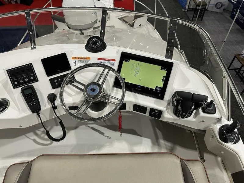 Slide: The Image of 2025 Cutwater C-32 CB LE helm with modern navigation and control systems. - 17