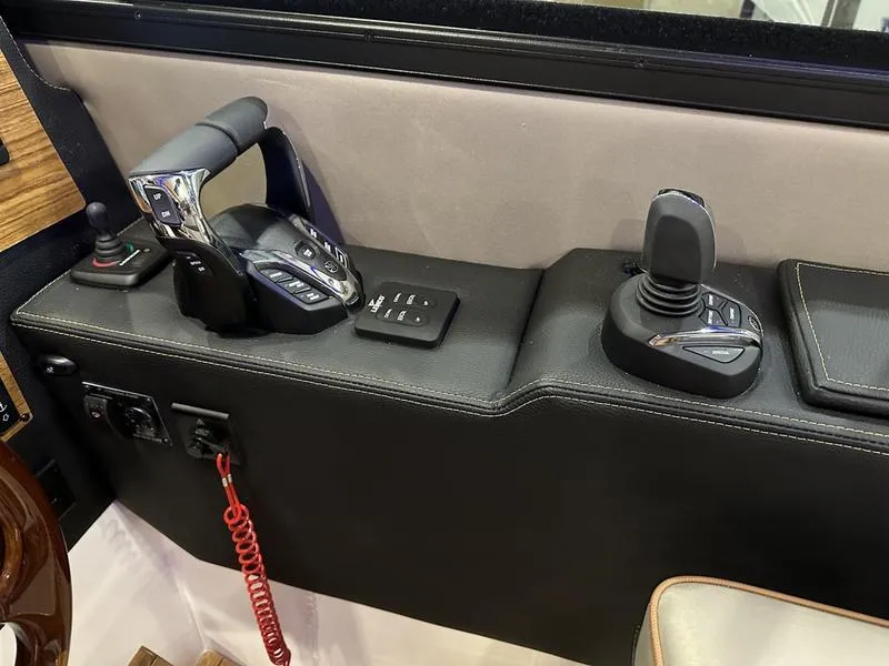 Slide: The Image of Control panel of 2025 Cutwater C-32 CB LE boat with joystick and throttle. - 23