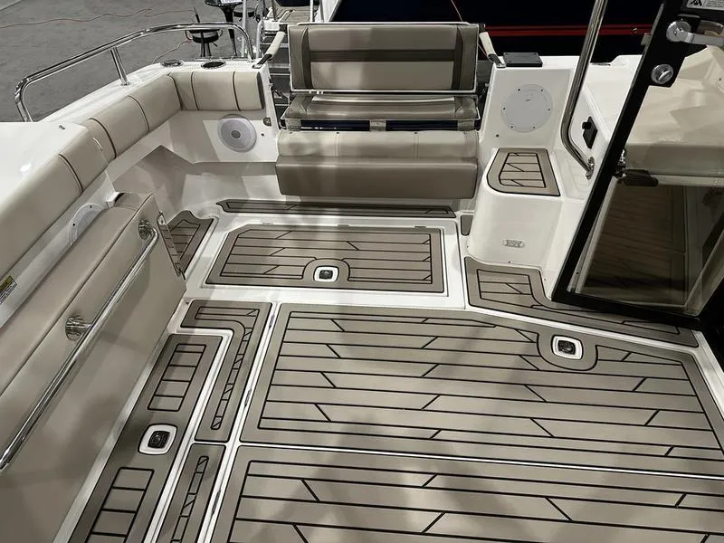 Slide: The Image of 2025 Cutwater C-32 CB LE boat interior with sleek seating and modern flooring design. - 8