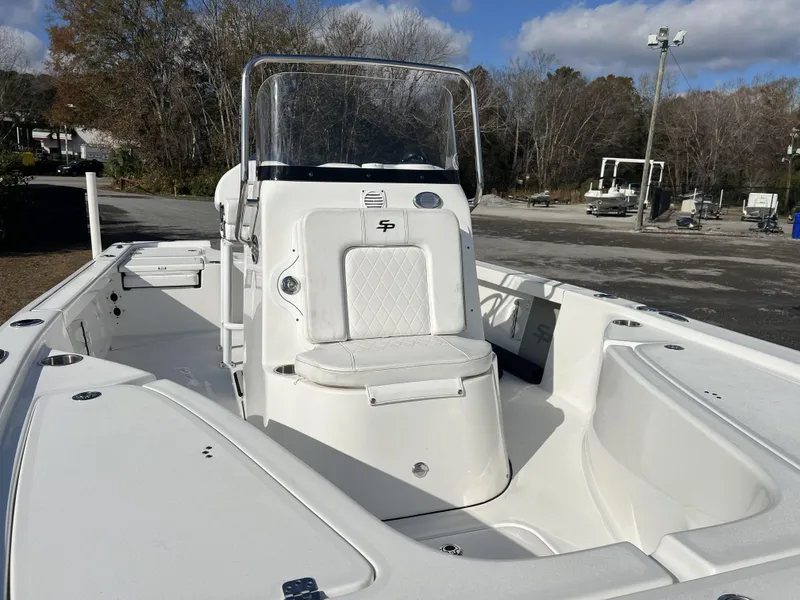 Slide: The Image of 2023 Sea Pro 208 Bay boat with center console, parked outdoors. - 4