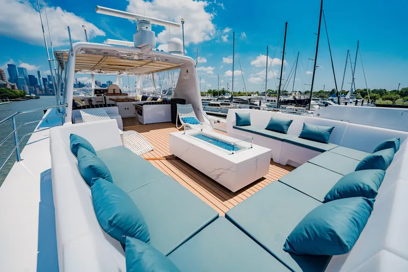 Slide: The Image of Luxurious 1987 Guy Couach 97 yacht with spacious deck and elegant seating. - 15