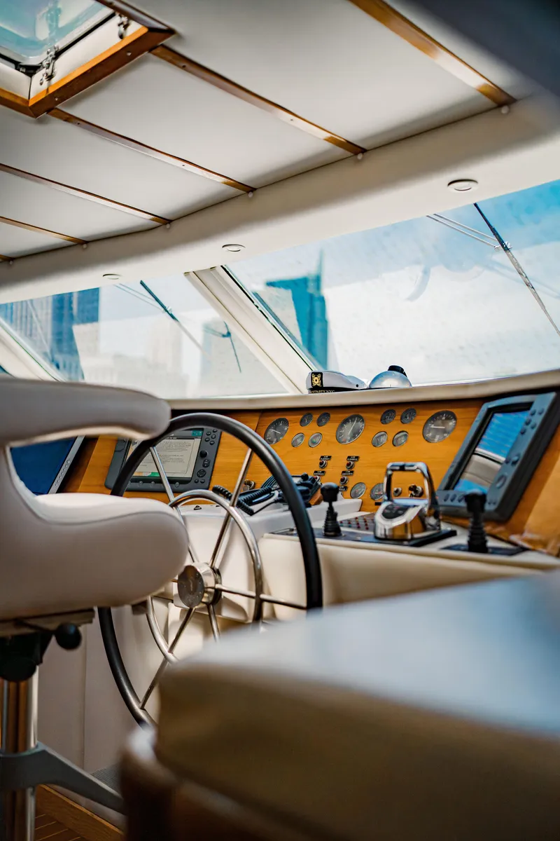 Slide: The Image of Interior view of 1987 Guy Couach 97 yacht cockpit with steering wheel and control panel. - 27