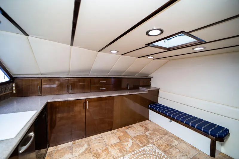 Slide: The Image of Luxurious interior of 1987 Guy Couach 97 yacht with modern cabinetry and seating. - 32
