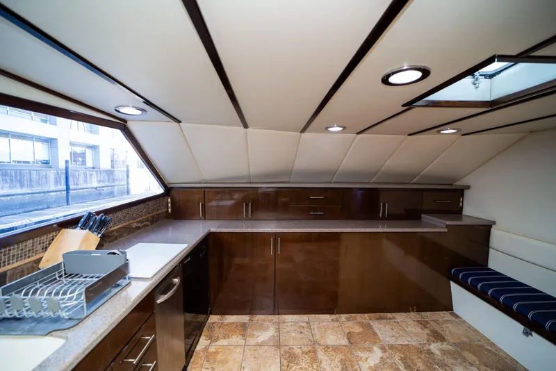 Slide: The Image of Luxurious kitchen interior of 1987 Guy Couach 97 yacht with modern amenities and sleek design. - 33
