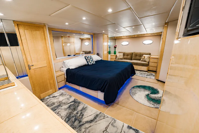 Slide: The Image of Luxurious bedroom interior on 1987 Guy Couach 97 yacht with modern decor and ambient lighting. - 34