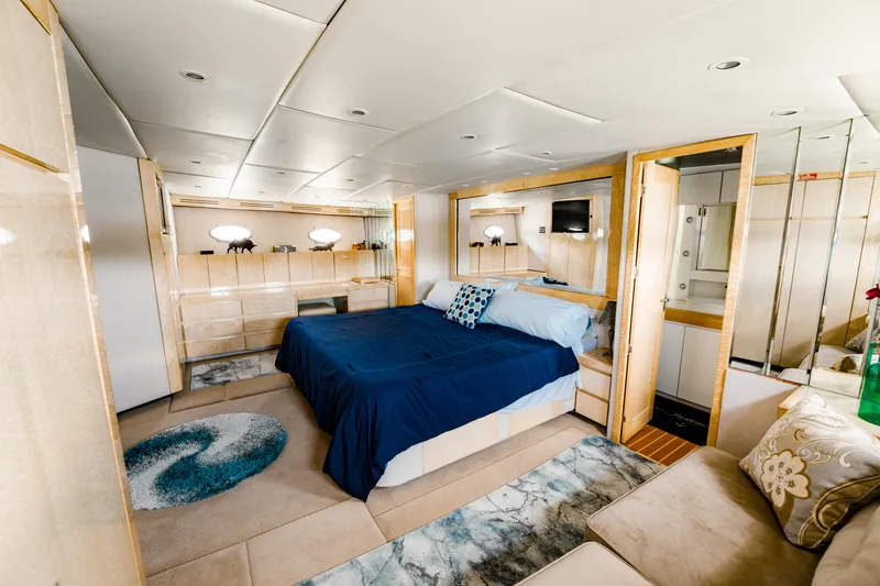 Slide: The Image of Luxurious bedroom interior of 1987 Guy Couach 97 yacht with modern decor and cozy bedding. - 35