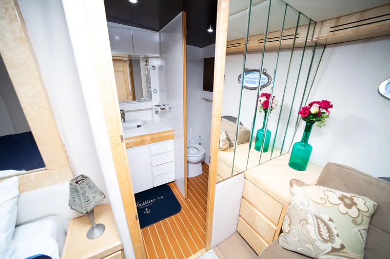 Slide: The Image of Luxurious 1987 Guy Couach 97 yacht interior with elegant bathroom and cozy seating area. - 36