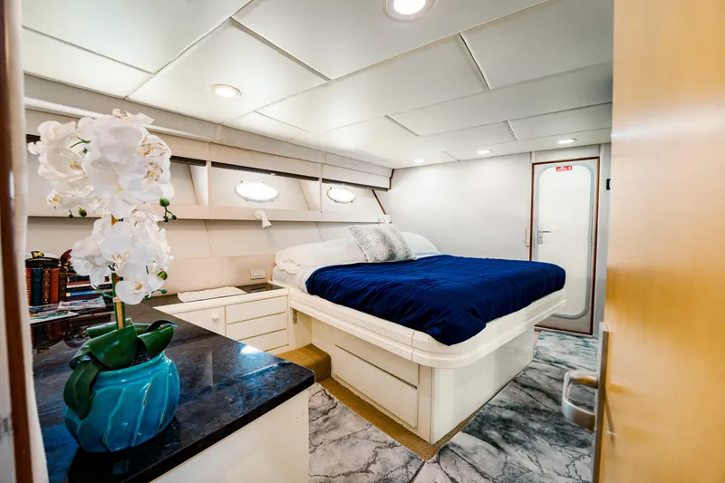 Slide: The Image of Luxurious 1987 Guy Couach 97 yacht bedroom with elegant decor and modern amenities. - 39