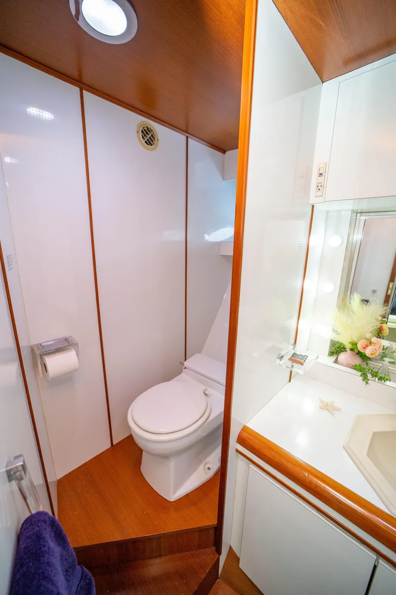 Slide: The Image of Luxurious bathroom in 1987 Guy Couach 97 yacht with modern fixtures and wooden accents. - 42
