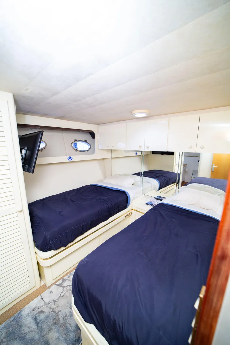 Slide: The Image of Twin cabin with blue bedding in 1987 Guy Couach 97 yacht. - 47