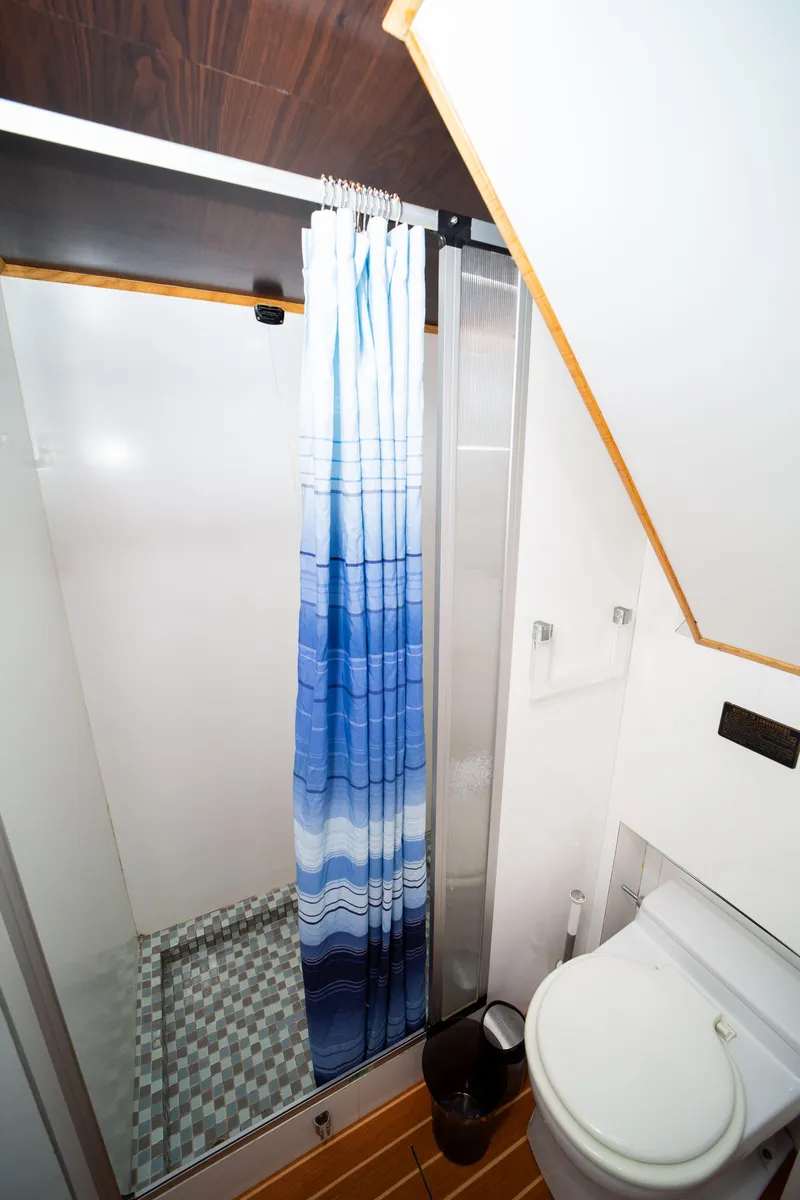 Slide: The Image of Bathroom interior of 1987 Guy Couach 97 yacht with shower and toilet. - 48
