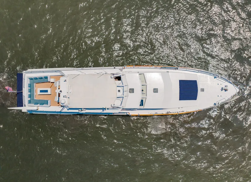 Slide: The Image of Aerial view of 1987 Guy Couach 97 yacht on water. - 5