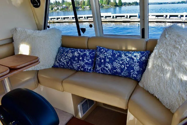 Slide: The Image of Luxurious interior of 2004 Meridian 490 Pilothouse with plush seating and scenic water view. - 13