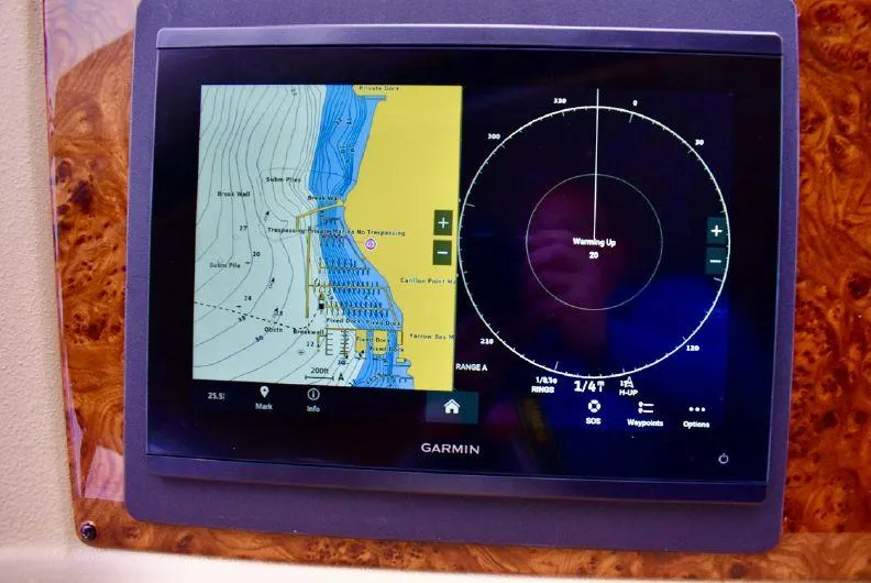 Slide: The Image of Garmin navigation display on 2004 Meridian 490 Pilothouse, showing map and radar interface. - 15