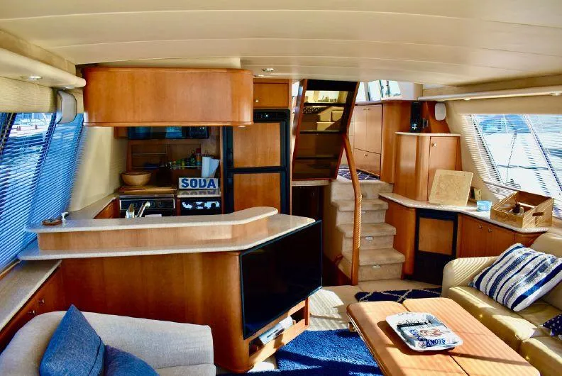 Slide: The Image of Interior of 2004 Meridian 490 Pilothouse yacht with modern furnishings and cozy seating area. - 2