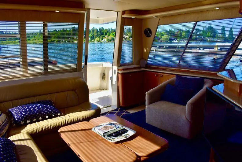 Slide: The Image of Luxurious interior of 2004 Meridian 490 Pilothouse yacht with scenic water views. - 21