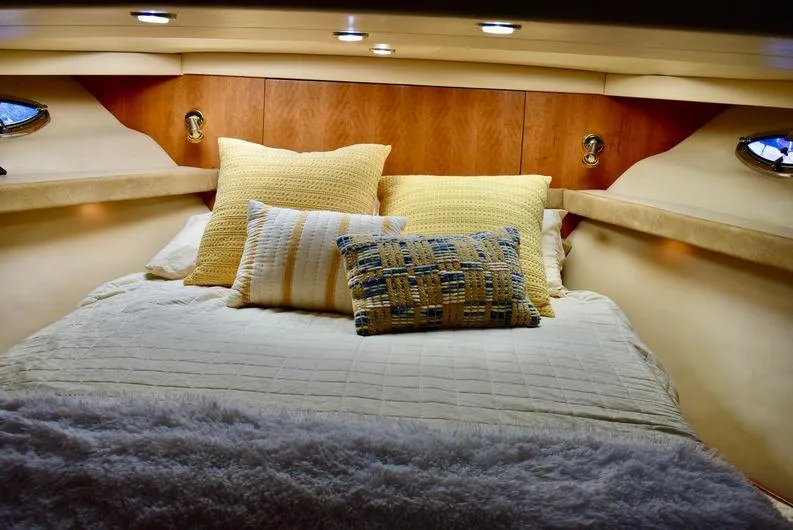 Slide: The Image of Luxurious bedroom interior of 2004 Meridian 490 Pilothouse yacht with cozy bedding. - 28