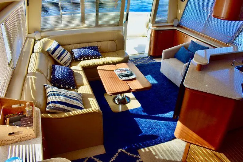 Slide: The Image of Luxurious interior of 2004 Meridian 490 Pilothouse yacht with elegant seating and nautical decor. - 3