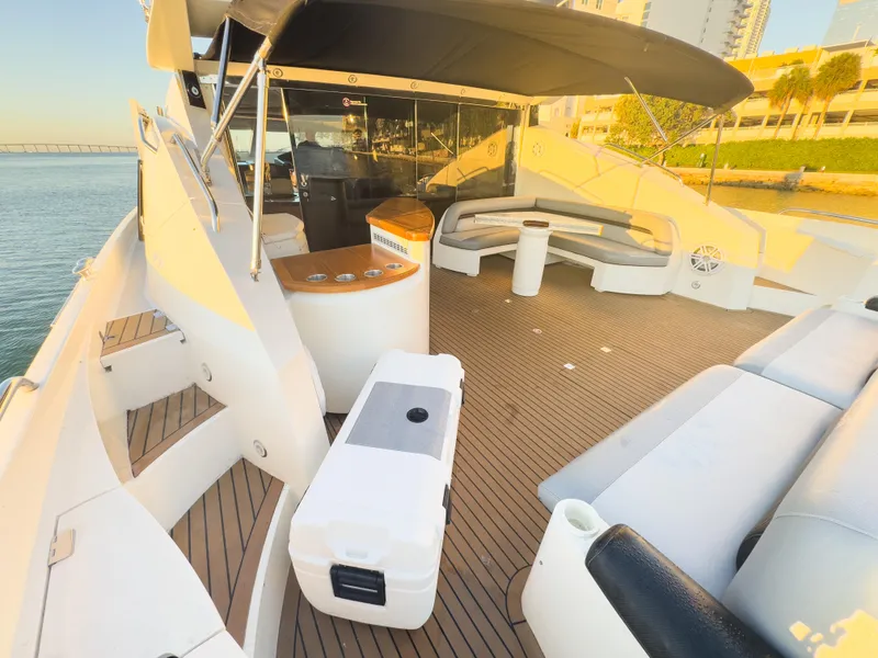 Slide: The Image of Luxurious 2006 Sunseeker Predator 82 yacht deck with seating and ocean view. - 11